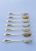 Various types of rice on Asian spoons
