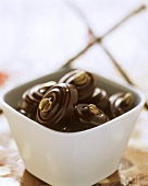 Mocha chocolates in white bowl