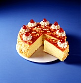 Sponge cake with butter cream, cherry icing and cherries