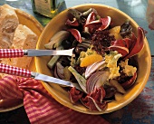 Winter salad: red salad leaves, olives & orange segments