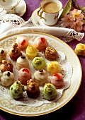 Various petit fours on biscuit plate