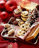 Assorted biscuits in wooden box and on tray