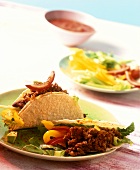 Tacos with red chili sauce, mince and bean puree