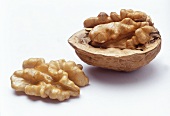 Two walnut halves, with and without shell