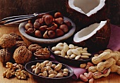 Still life with various nuts and a nut cracker