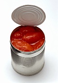 Peeled tomatoes in an opened tin