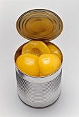 Peaches in an opened tin