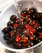 Washing cherries in strainer