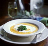 Cream of pumpkin soup with herbs