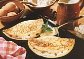 Pancakes with quark and raisin filling on baking tray