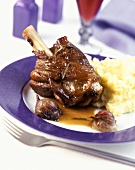 Lamb shank with onions and mashed potato