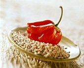 Mini-peppers and pearl barley on plate