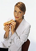 Young woman holding a hot dog