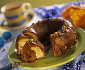 Marble cake ring with chocolate icing and chocolate beans