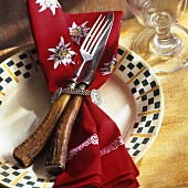 Cutlery with stag's horn handles on traditional fabric napkin