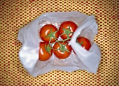 Truss of tomatoes in a plastic bag