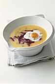 Potato soup with beetroot and fried quail's egg