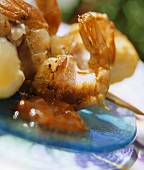 Grilled jumbo prawns wrapped in bacon with barbecue sauce