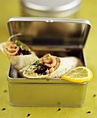 Wraps with shrimp salad filling in lunchbox