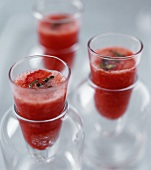 Chilled gazpacho (tomato & vegetable soup) in glass beakers