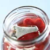 Mould on a jar of bottled fruit