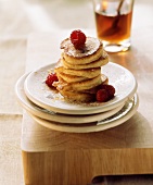 Potato pancakes with maple syrup and raspberries