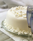 English Christmas cake, champagne glasses in front