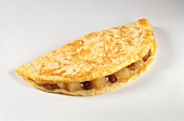 Omelette with apple and raisin filling