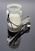 Making vanilla sugar: sugar with vanilla pod in jar