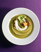 Cream of pea soup with croutons and crème fraiche