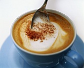 Cappuccino with spoon