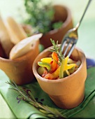 Chopped ratatouille vegetables in terracotta pot