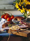 Still life with fish (sea bass), crabs, tomatoes