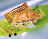 Fried salmon with coconut milk and thin noodles