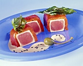 Tuna wrapped in red peppers and capers, sushi style