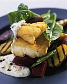 Fried haddock with beetroot, potatoes and spinach