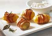 Potatoes wrapped in bacon, with radish quark