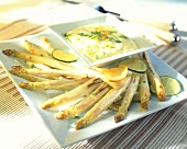 Baked white asparagus with orange and lime sauce