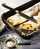 Karlsbad strudel, a piece cut, in the baking tin