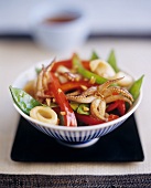 Chinese stir-fried cuttlefish with vegetables in bowl