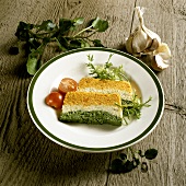 Two slices of vegetable terrine on plate