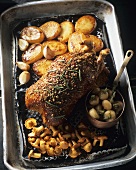 Glazed duck with roast potatoes, garlic and turnip