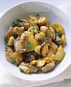 Pan-cooked potatoes and mushrooms with sausage pieces