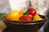 Red and yellow peppers in a bowl