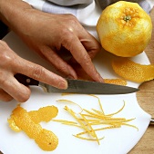 Cutting orange peel into fine julienne strips