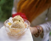Apricot ice cream garnished with apricot wedges & Pan Masala