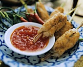 Thai fish and shrimp rolls on chili sauce