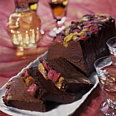 A chocolate cake, pieces cut