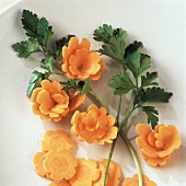Carved carrot flowers with carrot leaves