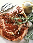 A slice of entrecote with sprig of rosemary